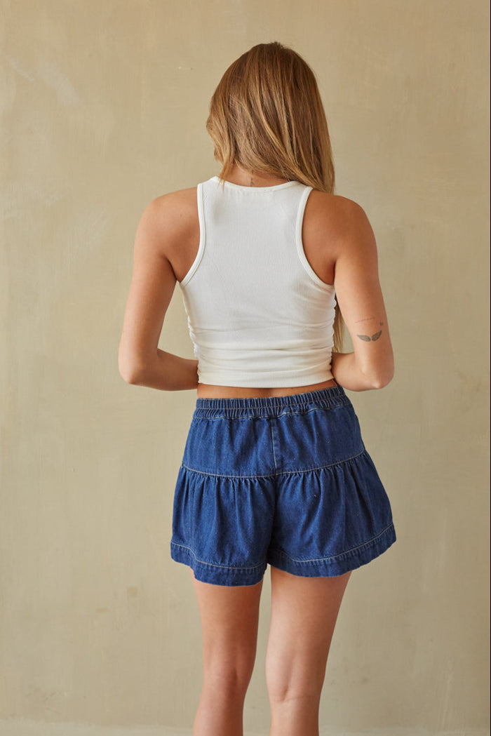 back-image | denim button-up skirt | relaxed | the skirt from the back, showing the simple and flattering cut with the button details