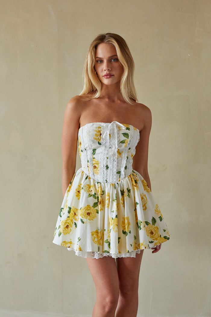 yellow-image | Front-image | Yellow Strapless Dress | close-up showing the lace trim on the bodice and the soft, airy fabric of the skirt.