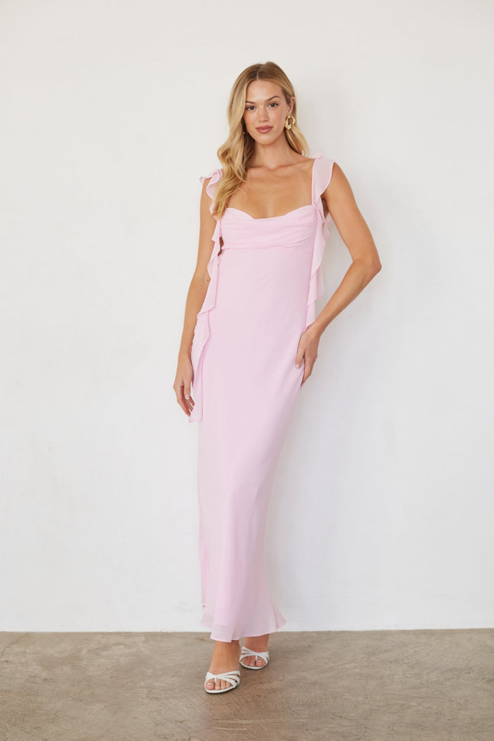 pink-image  | Woman wearing a pink dress against a white background