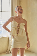 pastel yellow tie front peplum baby doll top with tie spaghetti straps
