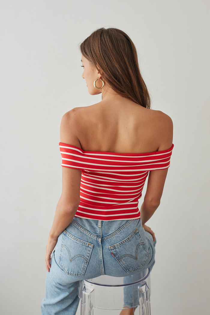back-image | red striped top with off-shoulder cut | denim bottoms | vibrant summer fashion | simple yet striking back design of an off-shoulder red and white striped top, complemented by a classic denim jean for effortless style