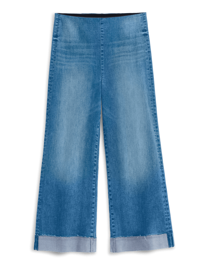Light blue wide-leg denim jeans with a faded wash and rolled cuffs, shown flat against a solid black background.
