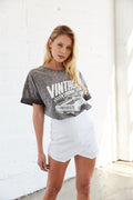 White envelope skort with graphic tee.